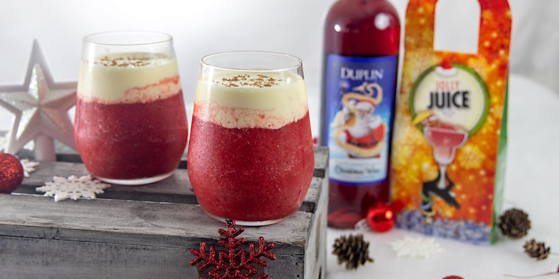A sweet, winter berry wine slushie with spiced rum, plus eggnog on top.