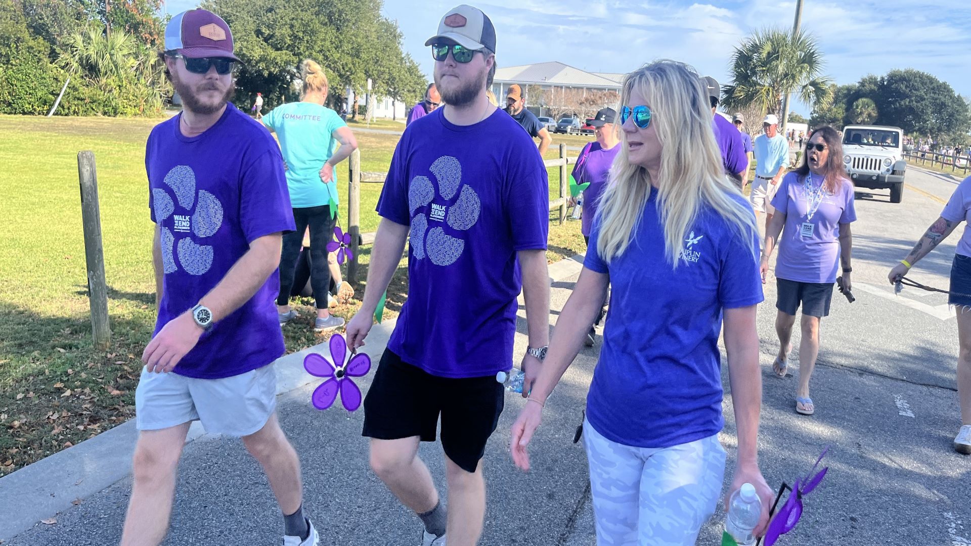 Cousins and Duplin winemakers Case Merritt and Gray Fussell walk with Fussell's mother, Angie Fussell, at the 2024 Walk to End Alzheimer's — Wilmington! on November 2, 2024, in Wrightsville Beach, N.C.