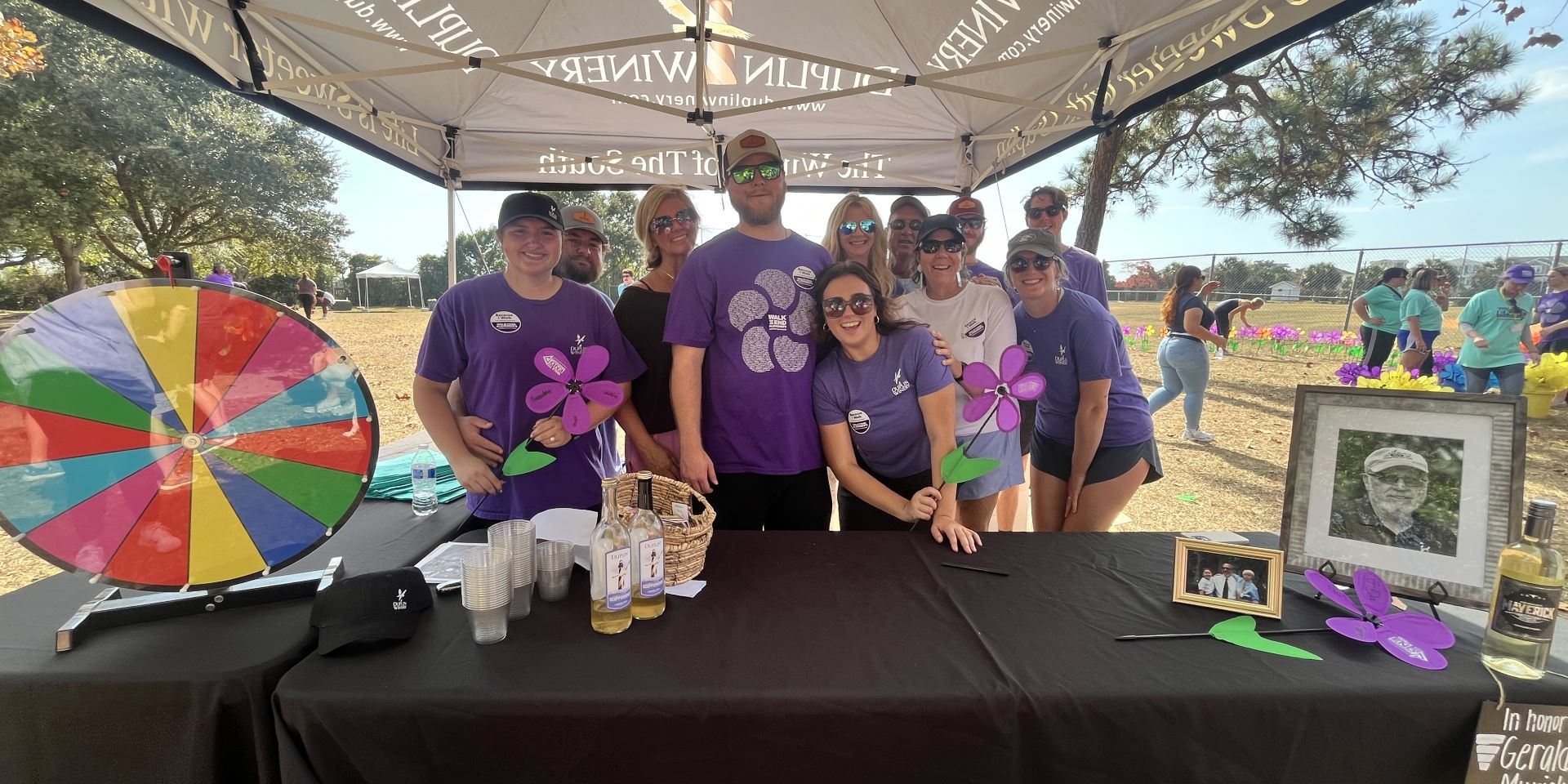 The Duplin Winery team, incluidng Gray Fussell; his wife, Sydney Fussell; and his mother, Angie Fussell, join the Duplin team at the 2024 Walk to End Alzheimer's — Wilmington! on November 2 in Wrightsville Beach, N.C.